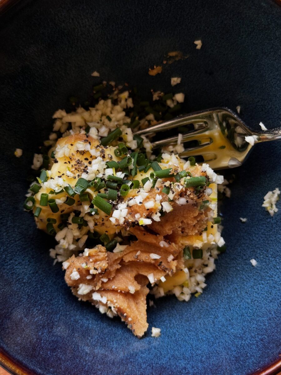 overhead photo of miso butter ingredients, unmixed, in a blue bowl