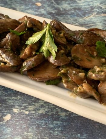 mushrooms on a tray with parsley