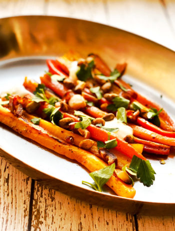 carrots on platter with fresh herbs