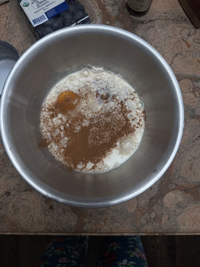 Overhead view of kodiak pancakes ingredients in a stainless steel bowl