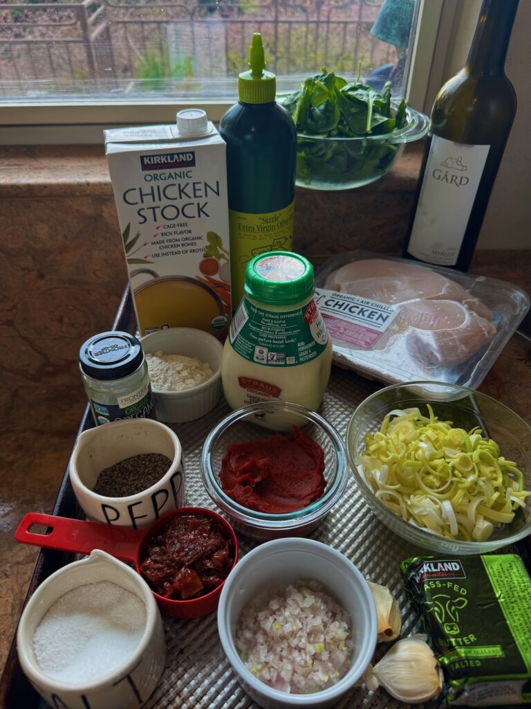 ingredients for chicken with sundried tomato on a tray